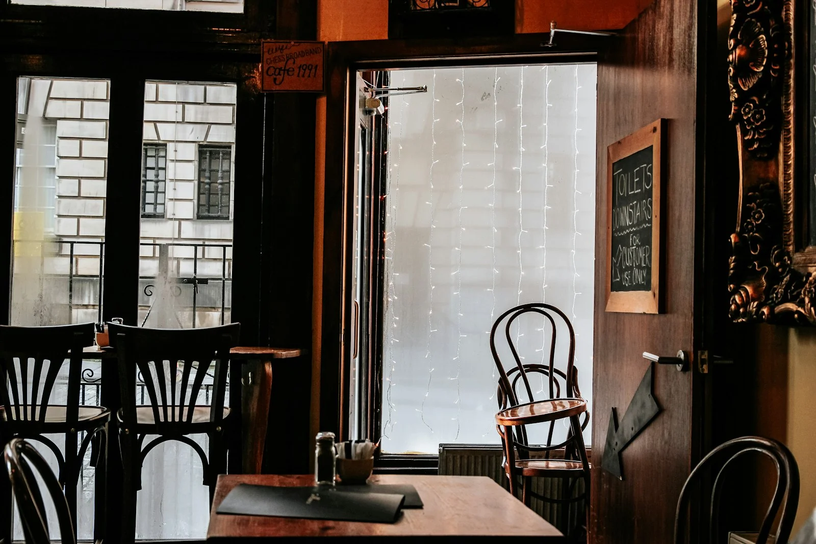 brown wooden chairs and table in room brown wooden chairs and table in room